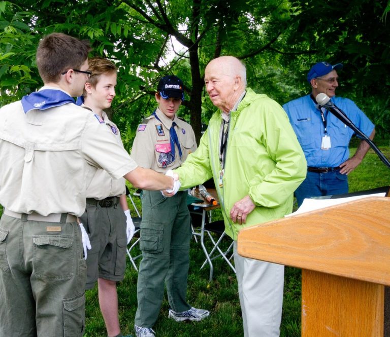 Stephen Bechtel shaking hands with Scouts