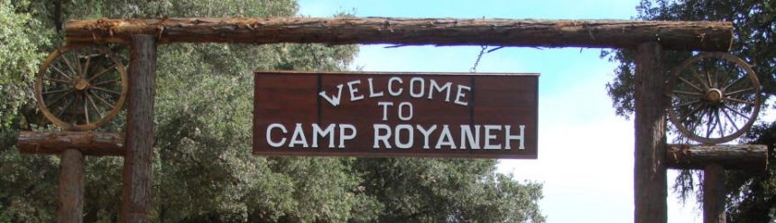 Welcome to Camp Royaneh sign at camp entrance.