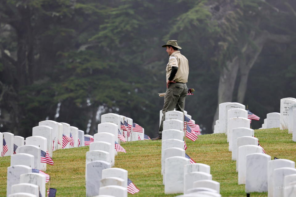 Scout leader in a moment of reflection at the Presidio flag planting event 