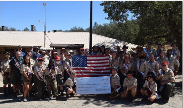 Picture of Yerba Buena Lodge members displaying check for Ukraine Scouts