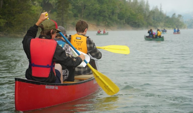 Scouts canoeing on a lake